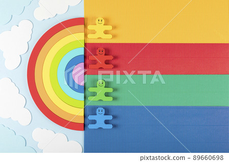 International Children's Day concept. Rainbow with wooden toys of children on the blue background. International Children's Day concept. Rainbow with wooden toys of children on the blue background. 89660698