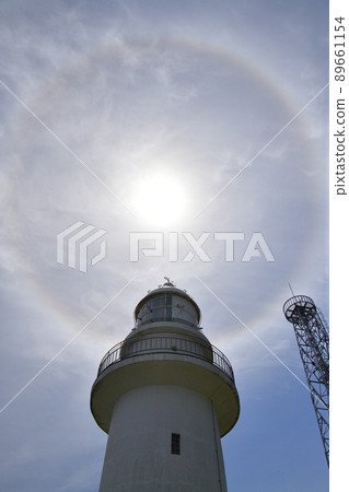 Photographing the scenery of Esanmisaki Lighthouse and the sun's umbrella at Todohokke, Hakodate, Hokkaido in the spring Photographing the scenery of Esanmisaki Lighthouse and the sun's umbrella at Todohokke, Hakodate, Hokkaido in the spring 89661154