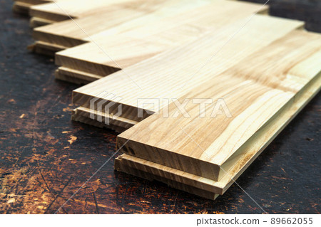 Several planks of beautiful laminate or parquet flooring with wooden texture as background Several planks of beautiful laminate or parquet flooring with wooden texture as background 89662055