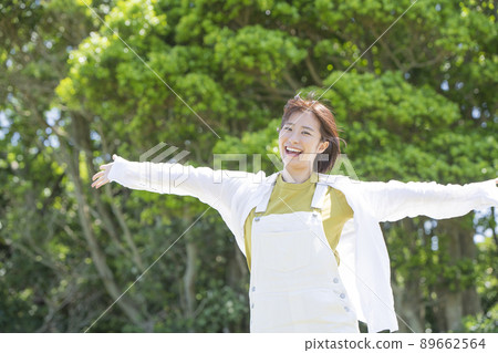A young woman walking in the park A young woman walking in the park 89662564