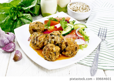 Meatballs with spinach and oatmeal on wooden table Meatballs with spinach and oatmeal on wooden table 89664601