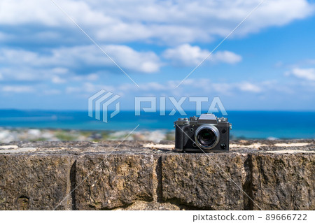 Take a picture of the view of the sea from a hill Take a picture of the view of the sea from a hill 89666722