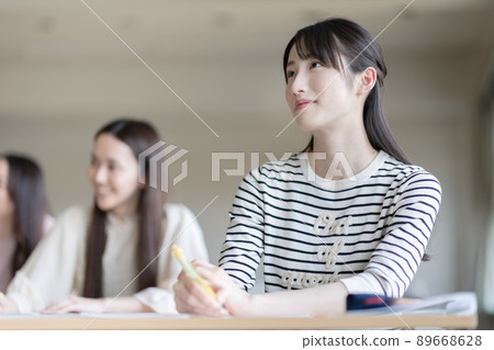 University students attending a lecture University students attending a lecture 89668628