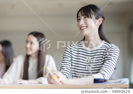 University students attending a lecture University students attending a lecture 89668629