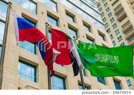 United Arab Emirates and Russia flag waving against building 89670914