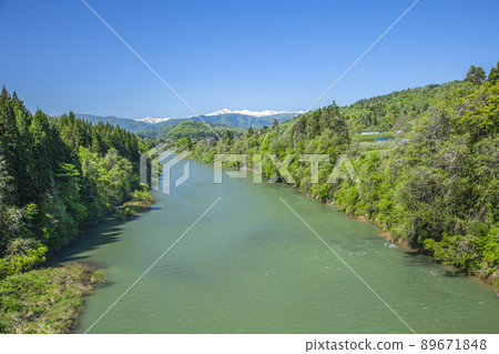 Mogami River and Asahi Mountain Range with Remaining Snow Mogami River and Asahi Mountain Range with Remaining Snow 89671848