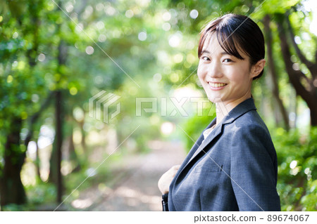 Business woman park 89674067