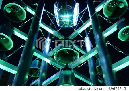 Clock tower illuminated by light 89674245