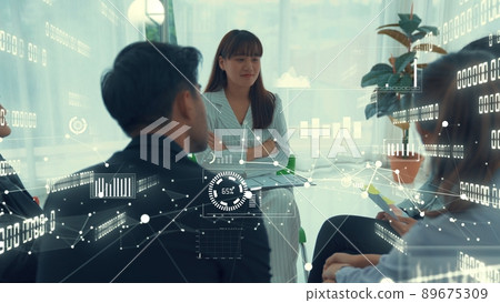 Business people in corporate staff meeting with envisional graphic Business people in corporate staff meeting with envisional graphic 89675309