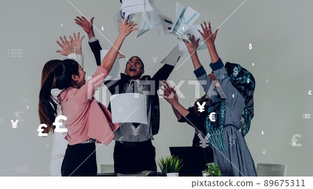 Business people throwing papers in the office with conceptual graphic 89675311
