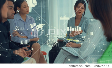 Business people in corporate staff meeting with envisional graphic Business people in corporate staff meeting with envisional graphic 89675383