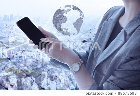 A woman with a smartphone and a landscape overlooking the city 89675698