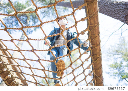 Boy playing well in the park 89678537