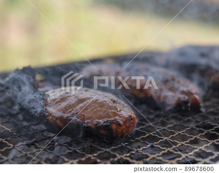 Charred pork meat on the grill Charred pork meat on the grill 89678600