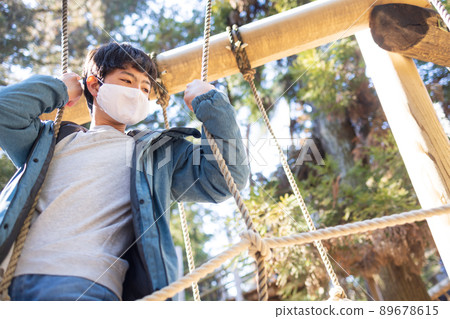 Boy playing well in the park 89678615