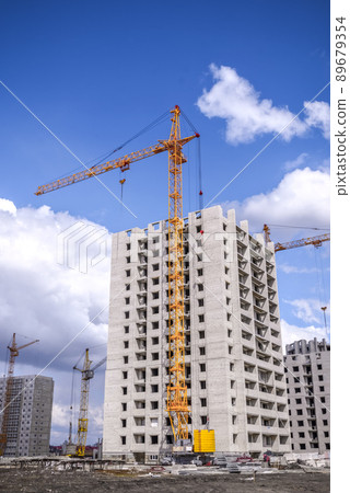 New multistorey housing and tall cranes New multistorey housing and tall cranes 89679354