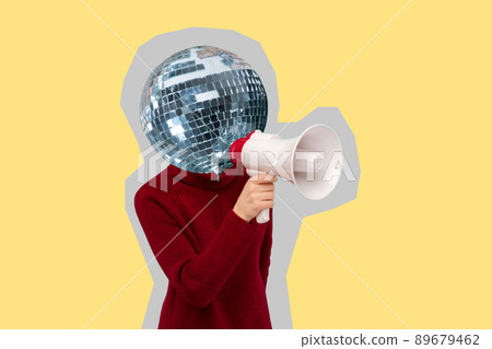 woman with a mirrored disco ball instead of a head holding a megaphone on yellow background woman with a mirrored disco ball instead of a head holding a megaphone on yellow background 89679462