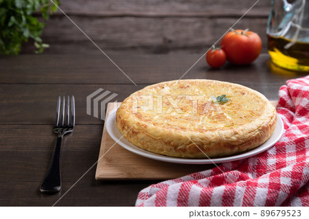 Traditional Spanish omelette dish, on rustic background with copy space. Spanish cuisine. 89679523