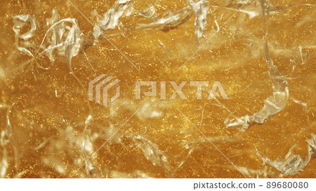 Golden glitters in water, abstract background. Golden glitters in water, abstract background. 89680080