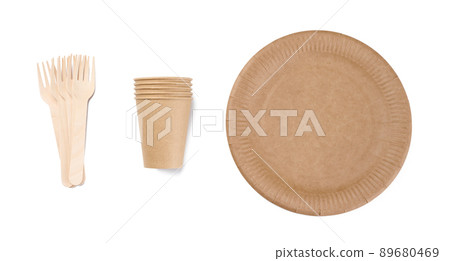Brown paper cups, wooden fork and plates on a white background. Recyclable garbage, rejection of plastic, 89680469