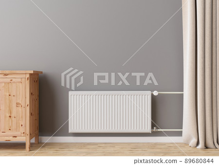 White heating radiator with thermostat on grey wall in modern room. Central heating system. Free, copy space for your text. 3D rendering. 89680844
