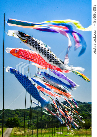 Carp streamers fluttering in the blue sky Carp streamers fluttering in the blue sky 89680885
