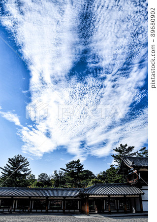 White clouds floating in the autumn sky and the Horyuji corridor White clouds floating in the autumn sky and the Horyuji corridor 89680902