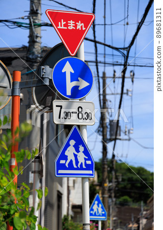 Traffic sign on the pedestrian crossing near the elementary school Traffic sign on the pedestrian crossing near the elementary school 89681311
