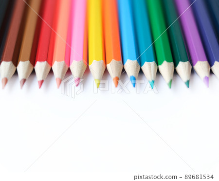 A set of colored pencils isolated on a white background in banner format. Place for text 89681534