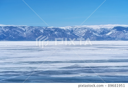 Winter landscape with mountains and Lake Baikal in Siberia on sunny day. Natural background. 89681951