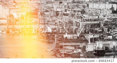 Top View Of Container Terminal In Port. Elevated View. toned black and white photo with yellow flare sunlight haze. Top View Of Container Terminal In Port. Elevated View. toned black and white photo with yellow flare sunlight haze. 89683417