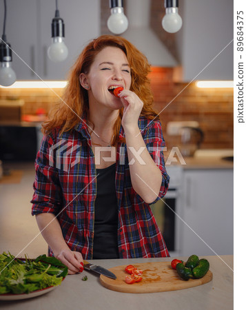 woman cooking fresh healthy vegan vegetable salad woman cooking fresh healthy vegan vegetable salad 89684375