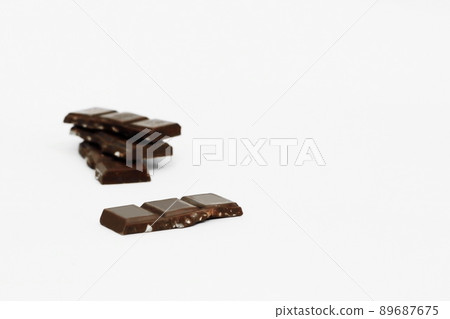 stack pieces of chocolate with nuts isolated on white stack pieces of chocolate with nuts isolated on white 89687675