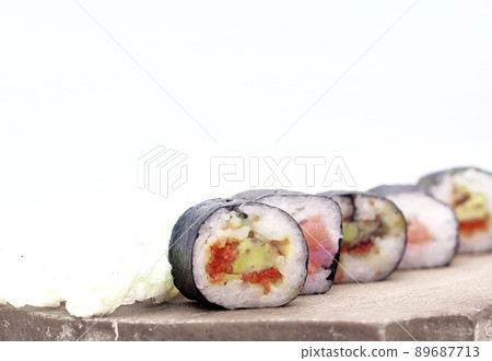 sushi rolls on a cutting Board.isolated on white sushi rolls on a cutting Board.isolated on white 89687713