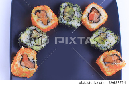 set of Sushi rolls on black plate set of Sushi rolls on black plate 89687714