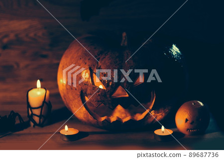candles,pumpkins and a spider on a wooden background candles,pumpkins and a spider on a wooden background 89687736