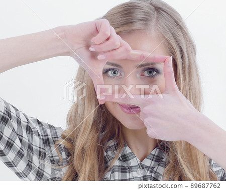 confident young business woman making hand frame confident young business woman making hand frame 89687762