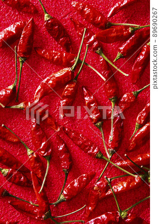 Hawk's claw chili red background 89690267