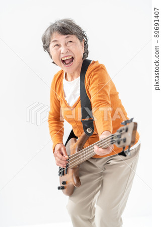 Female senior playing the base Female senior playing the base 89691407