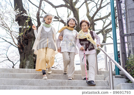 Senior woman descending stairs 89691793