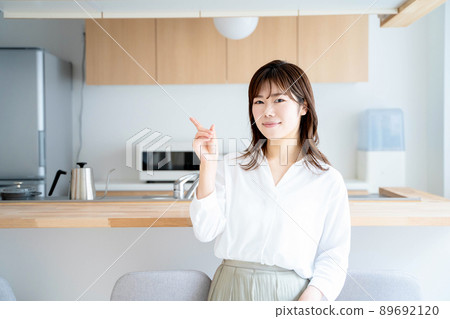 Young woman kitchen lifestyle Young woman kitchen lifestyle 89692120