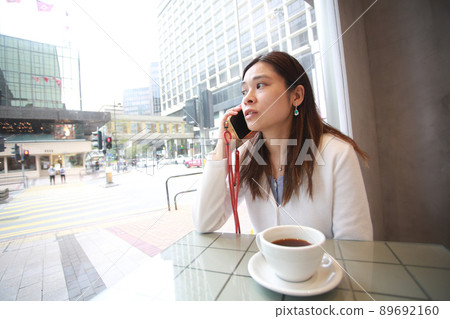 woman receive the call inside the cafe woman receive the call inside the cafe 89692160