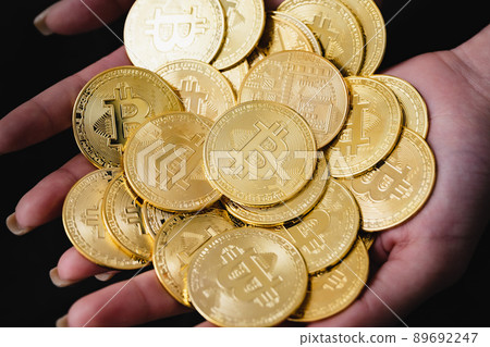 Bitcoin hand with virtual currency 89692247