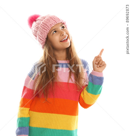 Cute little girl in warm clothes on white background. Winter vacation Cute little girl in warm clothes on white background. Winter vacation 89692873