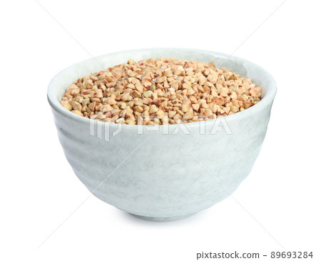 Green buckwheat in bowl isolated on white Green buckwheat in bowl isolated on white 89693284