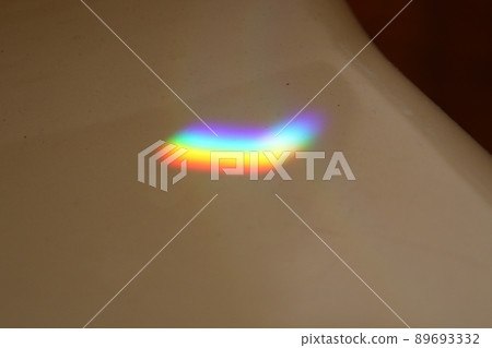 Multicolored sunbeam reflected on tiles Multicolored sunbeam reflected on tiles 89693332