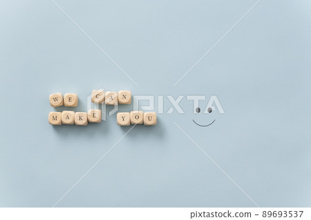We can make you happy sign spelled on wooden dice 89693537