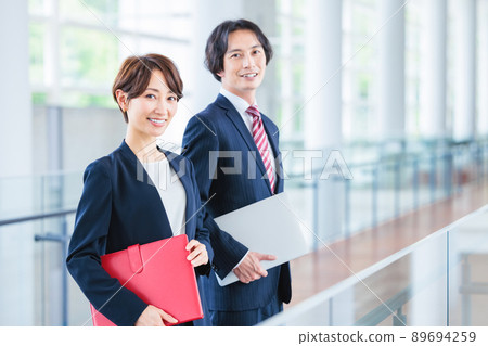 Image of male and female business person Image of male and female business person 89694259