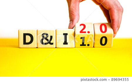 Diversity and inclusion 2.0 symbol. Businessman turns cubes and changes words Diversity and Inclusion 1.0 to 2.0. Beautiful white background. Business Diversity and inclusion 2.0 concept. Copy space. 89694355