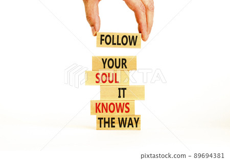 Motivation and inspiration symbol. Wood blocks with words Follow your soul it knows the way. Beautiful white background. Businessman hand. Business motivation and inspiration concept. Copy space. 89694381